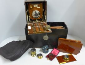 The Sanderson camera, early 20th Century, with original record book, lenses and accessories