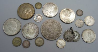 A collection of coins; three 1960's Canada one dollar, India half and one rupee, 1937 crown, 1925 US