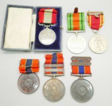 A silver Fire Brigade Long Service medallion, three other Fire Brigade medallions and two other