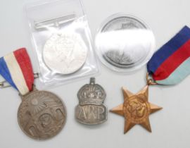 Two WWII medals, A.R.P. badge, Coronation medal and one other