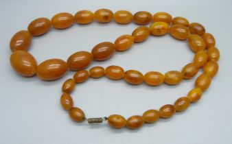 An amber coloured bead necklace