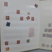 An album of stamps, eight penny reds, other Victorian and later British stamps