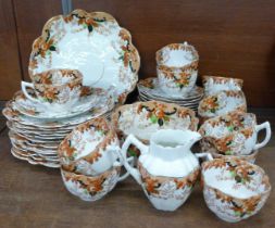 An early 20th Century tea service, Mayer-Sherratt, Longton, 12 trios, 2 plates, milk jug and