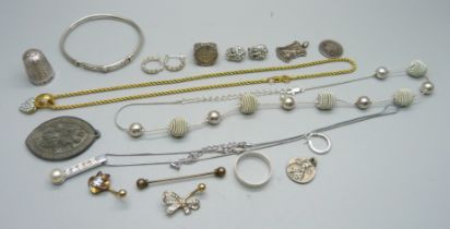 A Swarovski gold tone necklace, a Charles Horner thimble, two silver rings, two medallions, etc.