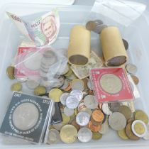 A collection of coins and banknotes including crowns