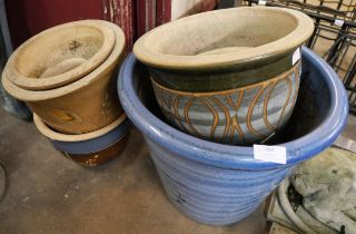 Eight glazed garden plant pots