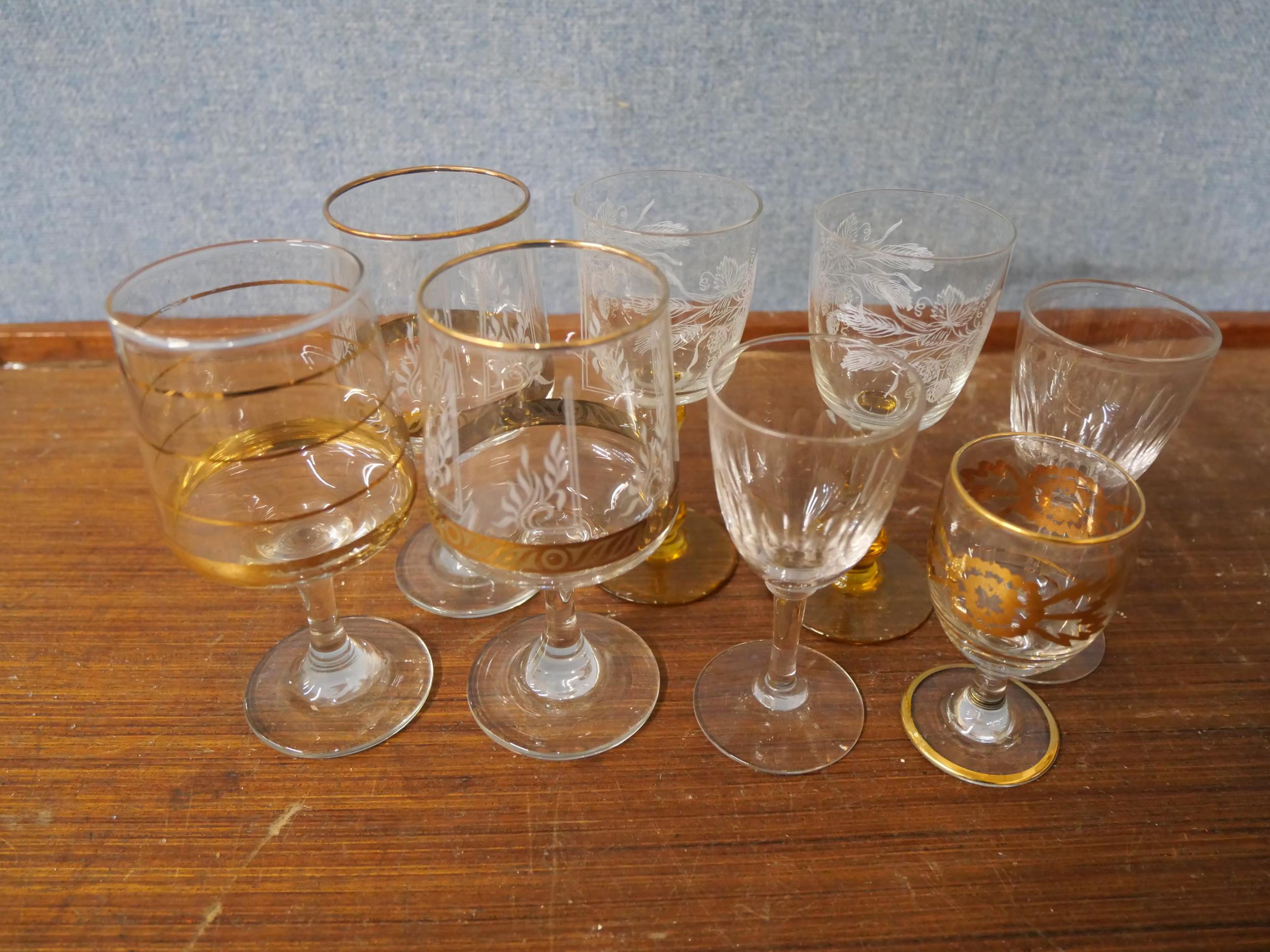 A collection of assorted china and etched drinking glasses
