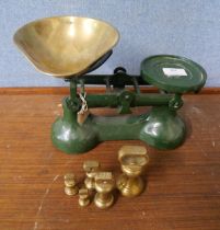 A set of Victor weighing scales with graduated brass weights