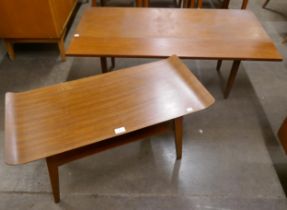 A sleigh top teak coffee table and one other