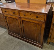 A George IV inlaid mahogany fitted two door press cupboard