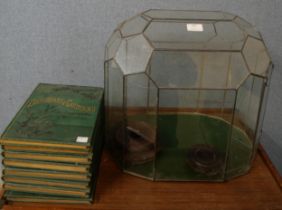 A glass terrarium, two Japanese carved stands and a complete set of The Dictionary of Gardening