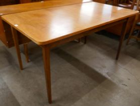 A teak extending dining table