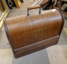 A cased Singer sewing machine