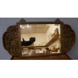 An oriental carved hardwood mirror