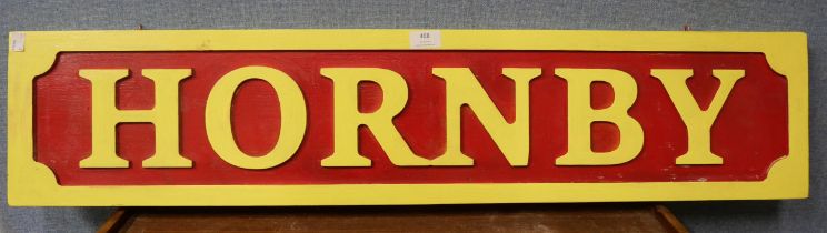 A wooden Hornby advertising sign