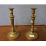 A pair of brass candlesticks