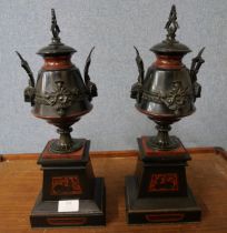 A pair of Egyptian Revival marble clock garnitures