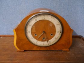An early 20th Century walnut mantel clock