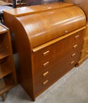 A Swedish S.M.I. teak cylinder bureau, designed by Ego Ostergaard