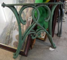 A pair of cast iron garden table legs