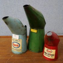Three Esso oil cans