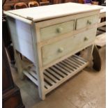 An early 20th Century painted pine four drawer pantry table