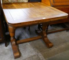 An oak draw-leaf table