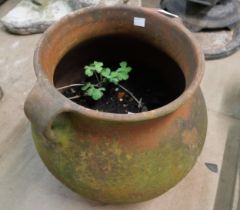 A terracotta two handled planter