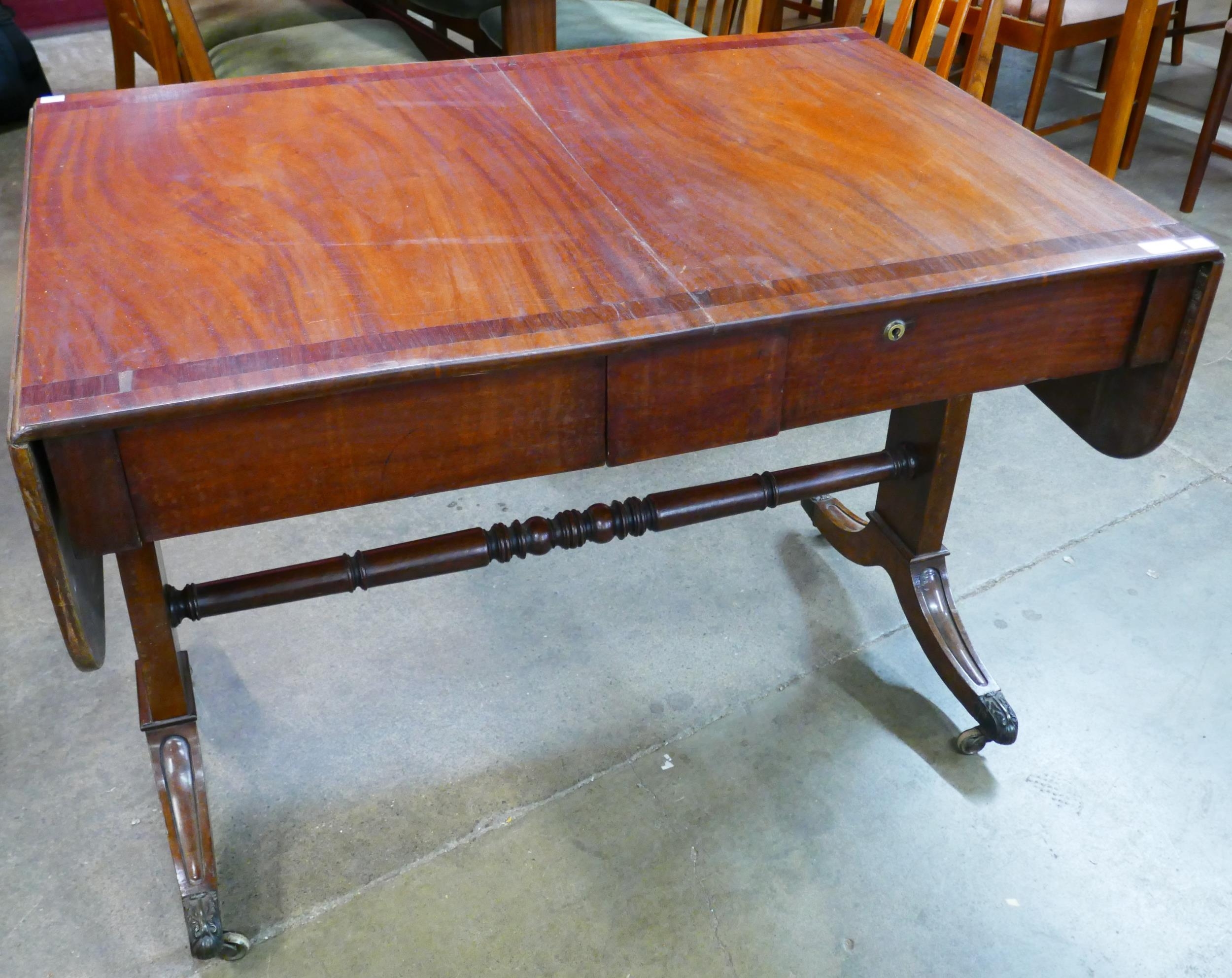 A George IV mahogany and rosewood crossbanded sofa table