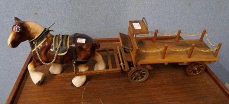 A horse and cart figure and a wooden block chess set