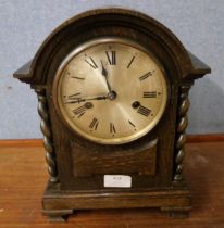 An early 20th Century oak mantel clock