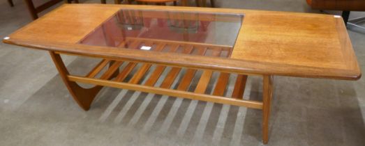 A G-Plan Astro teak and glass topped rectangular coffee table