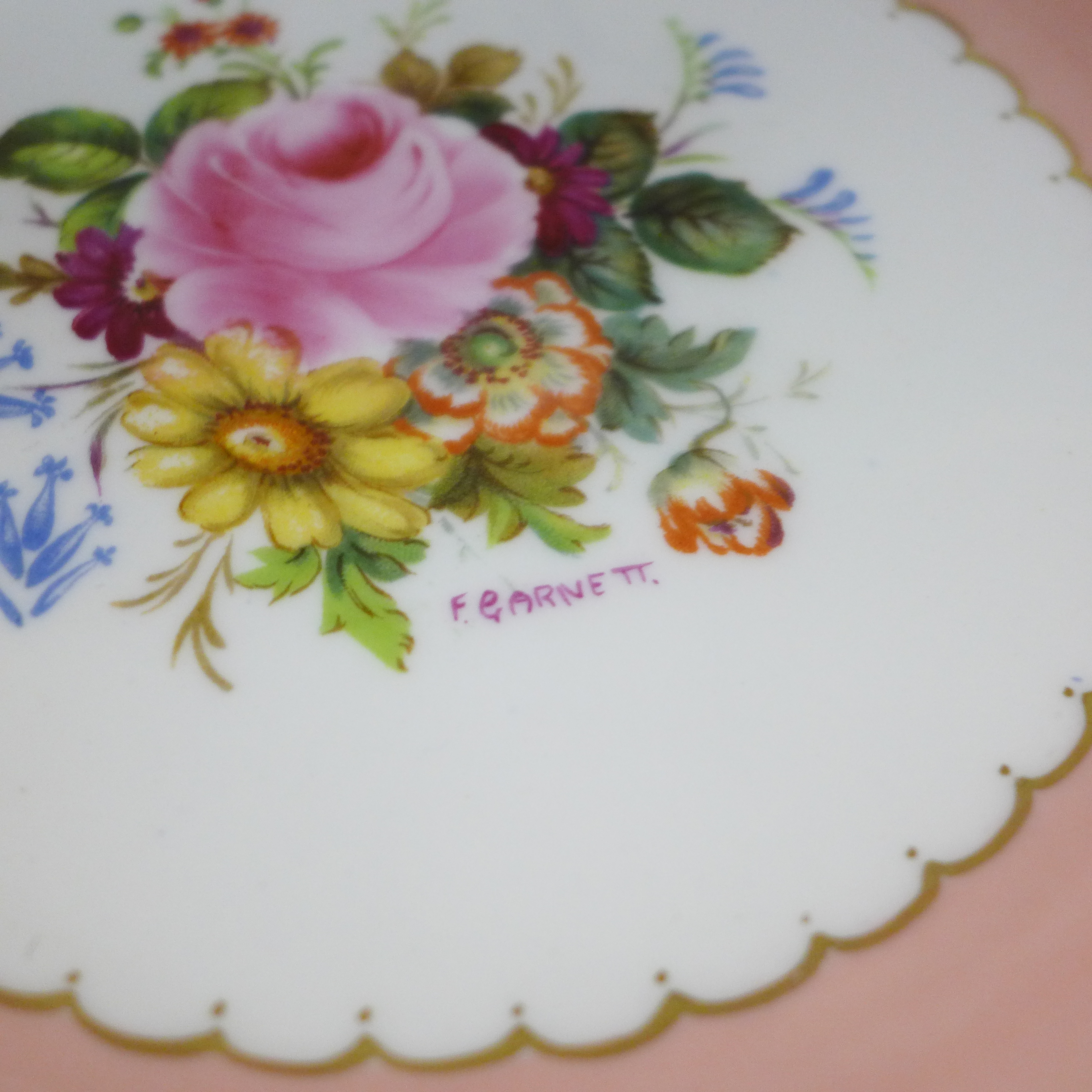 Three pink, one white and one green Royal Crown Derby vine pattern plates with hand painted floral - Image 4 of 8