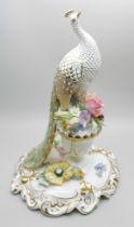 A Royal Crown Derby model of a peacock, signed Joan Lee and J. Plant, in original box