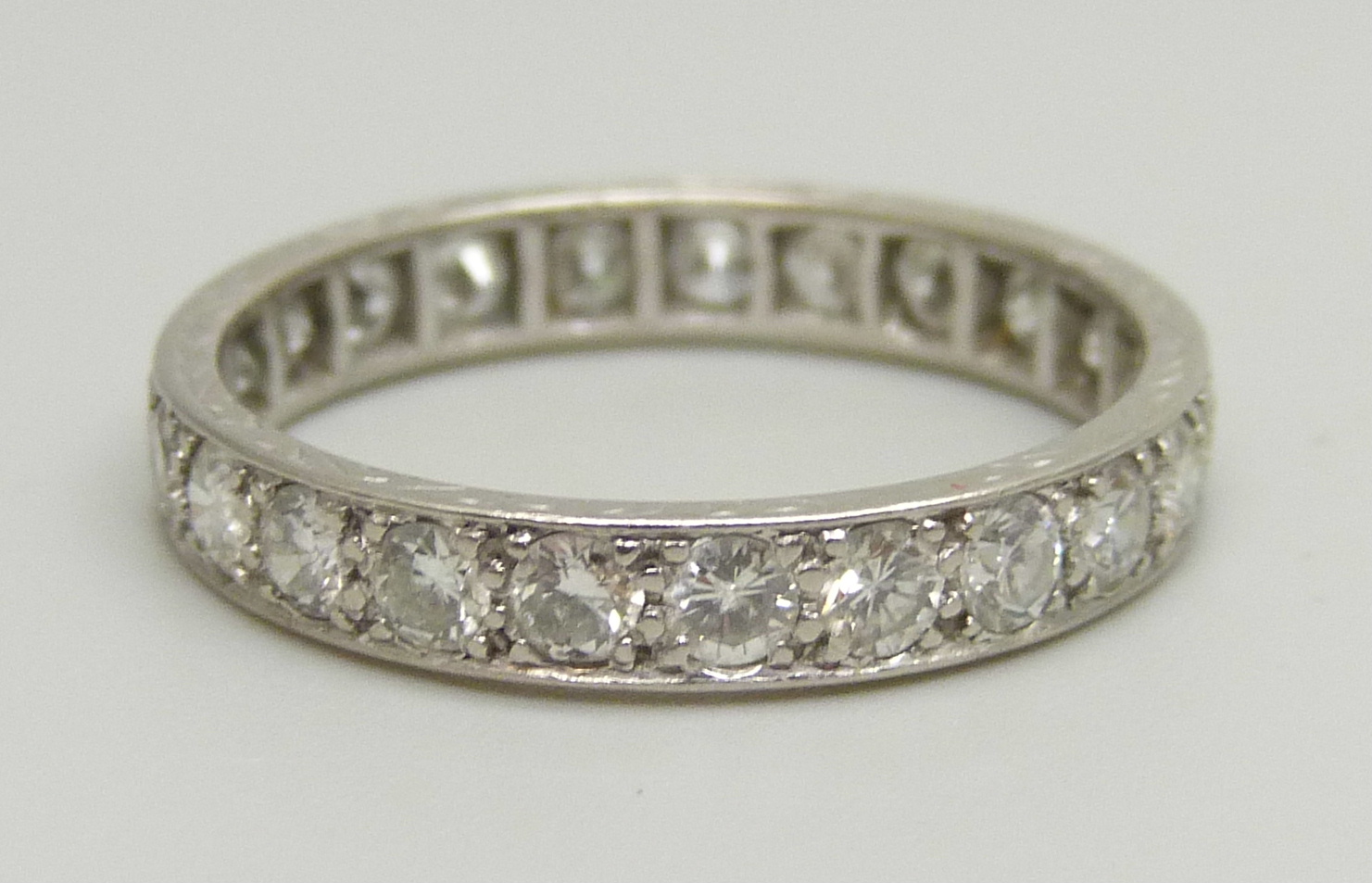 A white metal eternity ring set with approximately 2ct of diamonds, 3.2g, P - Image 3 of 4