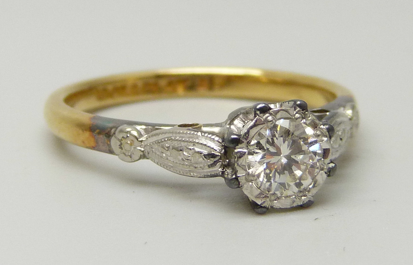 An 18ct yellow gold and platinum set round brilliant cut diamond solitaire ring, approximately 0. - Image 3 of 5