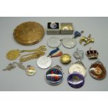 A collection of Royalty commemorative crowns, medallions and an Elizabeth II compact with London