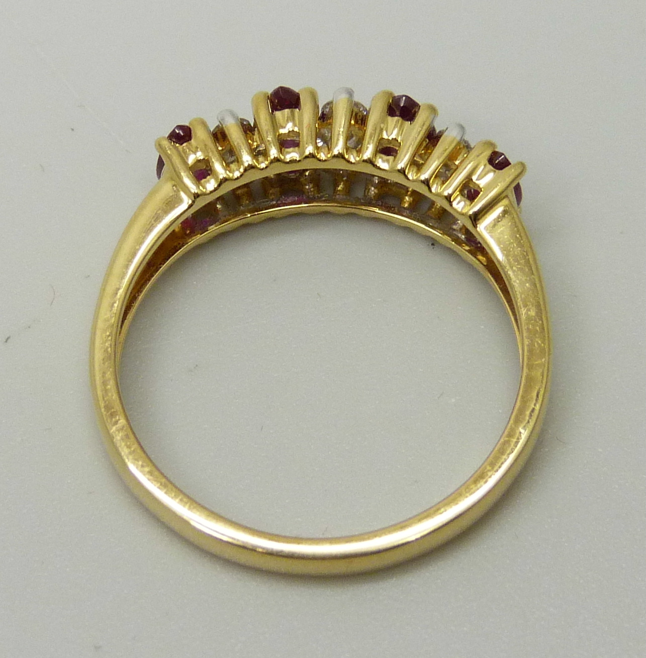 An 18ct yellow gold ring set with four marquise cut rubies and six round brilliant cut diamonds, - Image 4 of 4