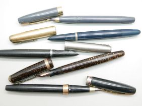 Three Parker fountain pens and two Sheaffer fountain pens