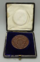 A Nottingham High School bronze medallion to G.B. Bryan, Good Conduct 1891 inscription, cased