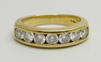 An 18ct yellow gold channel set half eternity ring with seven round brilliant cut diamonds,