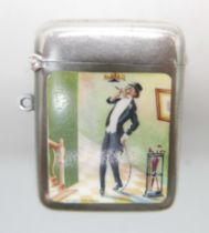 An Edward VII enamelled silver vesta case depicting a well dressed gentleman, 'The Light That