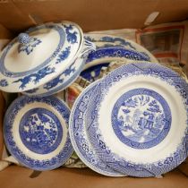 A collection of blue and white dinnerwares including Meakin and Booths, with three larger serving
