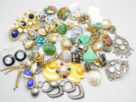A collection of vintage and modern earrings, including clip-on
