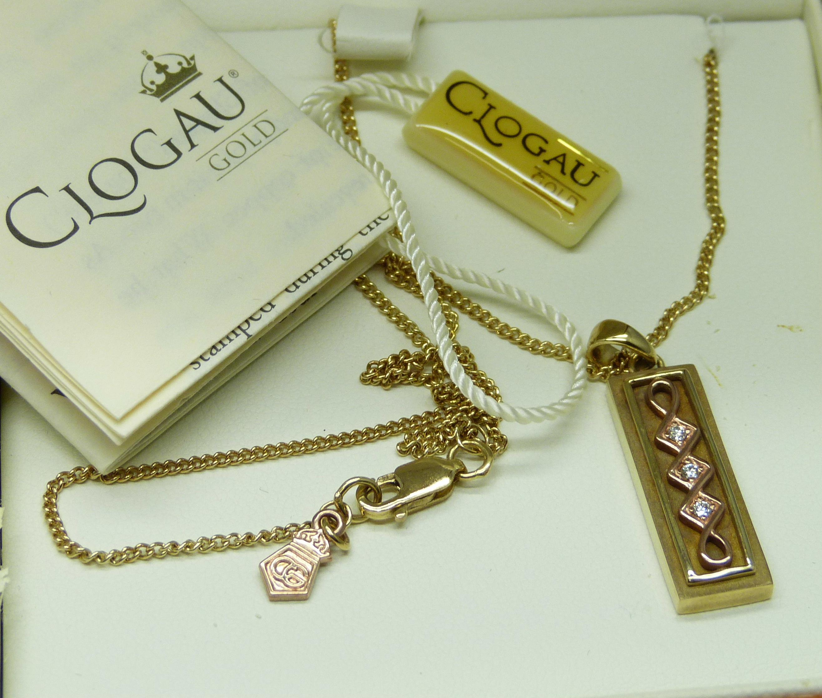 A limited edition Clogau Welsh 9ct gold ingot style pendant of Celtic design, set with three small - Image 5 of 5