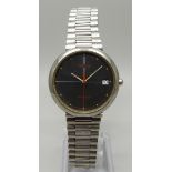 A vintage Tissot Seastar wristwatch with black face and red second sweep hand, with date and