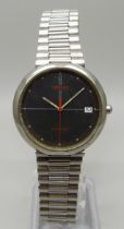 A vintage Tissot Seastar wristwatch with black face and red second sweep hand, with date and