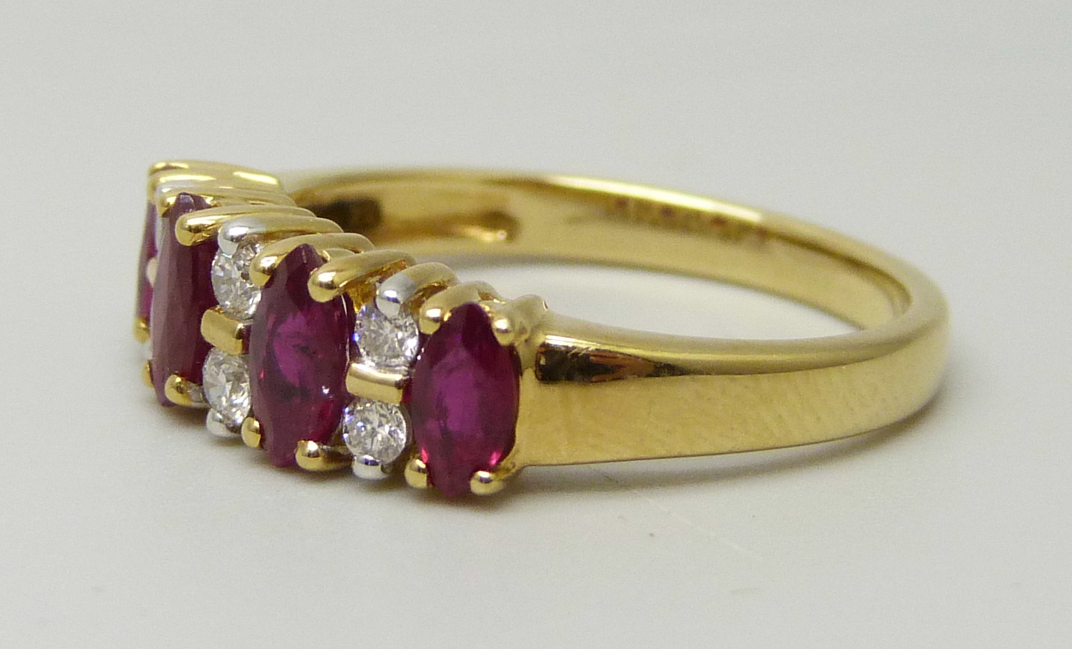 An 18ct yellow gold ring set with four marquise cut rubies and six round brilliant cut diamonds, - Image 2 of 4