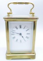 A brass and glass sided carriage clock