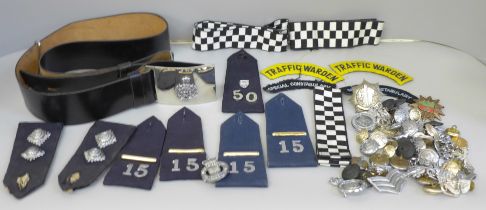 A collection of Police memorabilia including leather belt, epaulettes, badges and buttons, the